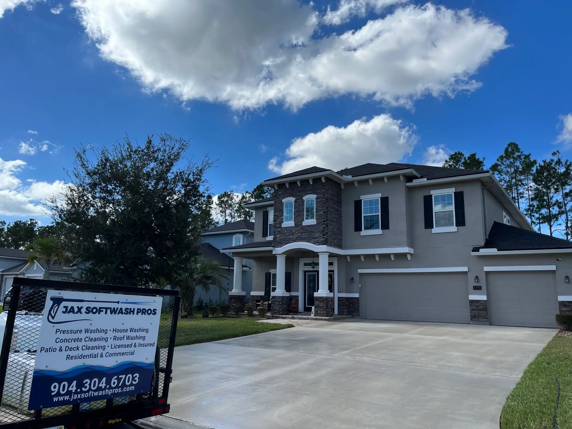 Jax Softwash Pros yard sign in front of a cleaned home
